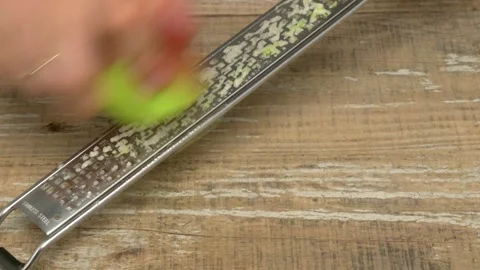 A rustic metal ruler rests elegantly on a weathered wooden surface, showcasing Video stock 280692299