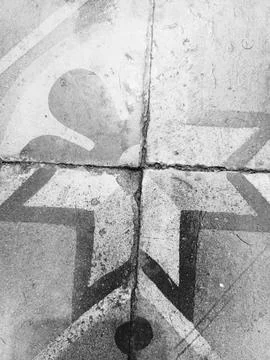 Rustic mismatched pattern floor tiles with broken layout background Stock Photos