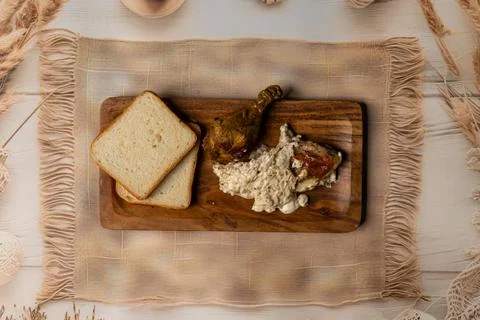 Rustic Mixed Food Platter With Chicken Curries Bread And Veggies Stock Photos