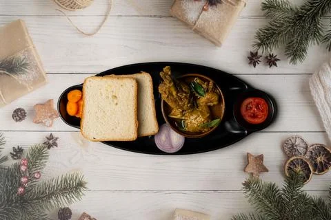 Rustic Mixed Food Platter With Chicken Curries Bread And Veggies Stock Photos