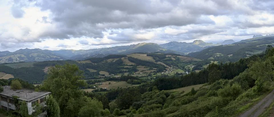 A Rustic mountain landscape with cloudy sky Stock Photos