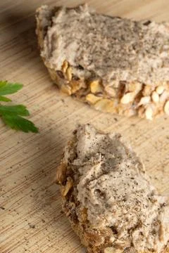 Rustic multigrain bread slice topped with fish spread. Stock Photos