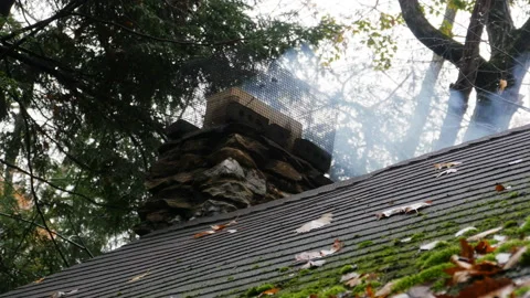 Rustic natural stone chimney with billowing smoke Stock Footage 153524411