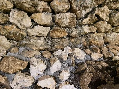 Rustic natural stone wall background. Stock-Fotos