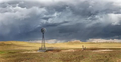Rustic old farming windmill in stormy weather Stock-Fotos