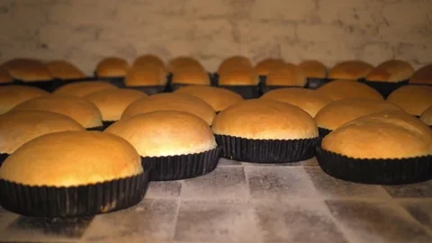 Rustic old retro oven that has lot of bread in it. Stock Footage 191603560