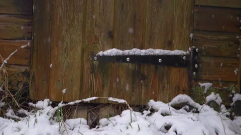 Rustic old shed in winter as snow falls Stock Footage 153053248
