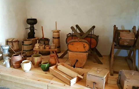 Rustic old utensils and ceramic jugs were used many years ago to make various Stock Photos