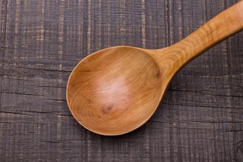 Rustic old wooden spoon. On the table. Stock Photos
