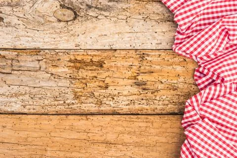 Rustic old wooden table with red checked tablecloth Stock Photos