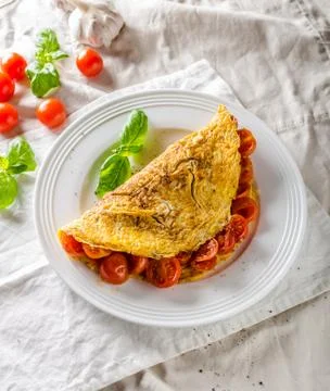 Rustic omelet with tomato Stock Photos
