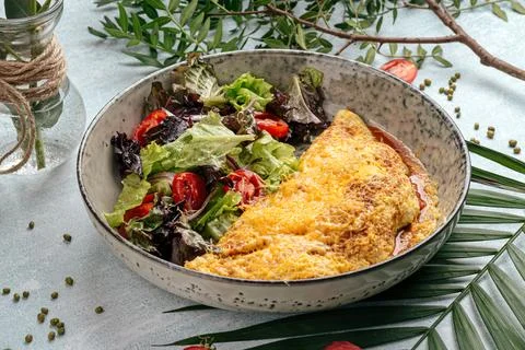Rustic omelette with vegetables salad Stock Photos