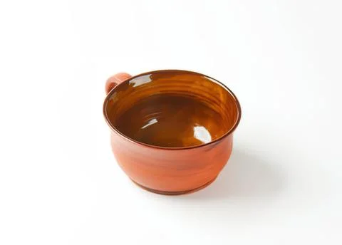 Rustic orange ceramic bowl with handle Photos
