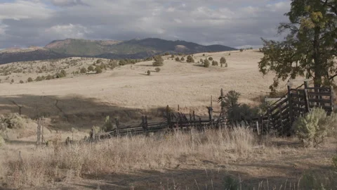 Rustic Oregon Landscape with a jackleg fence running along a hillside Stock Footage 332308762