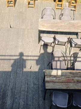 Rustic Outdoor Dining Tables With Chairs on Wooden Deck Foto stock