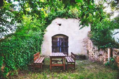 Rustic Outdoor Seating Surrounded by Greenery Stock Photos
