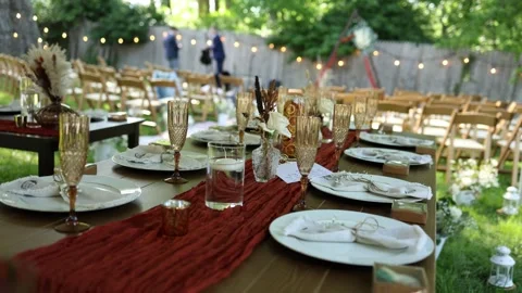 Rustic outdoor wedding table setting in backyard Stock Footage 337795576