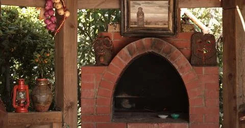 Rustic oven built with handmade bricks surrounded by natural elements inclu.. Stock Photos