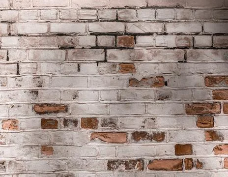 Rustic Painted Brick Wall Background with Weathered Surface 库存照片