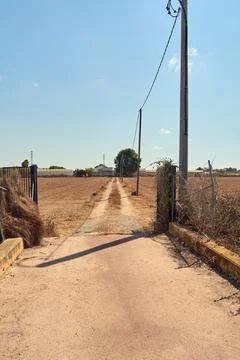 Rustic path towards an estate in the Spanish countryside Stock Photos