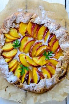 Rustic peach pie Stock Photos