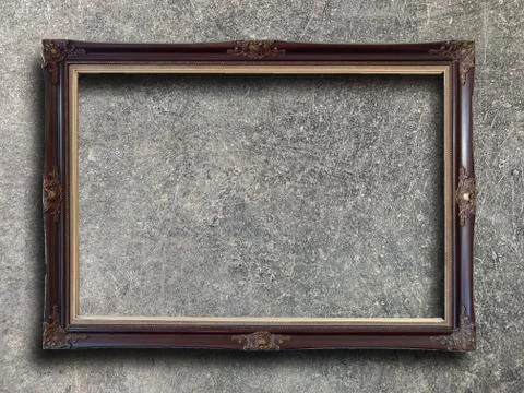 Rustic picture frame on cement wall Stock Photos