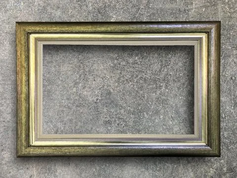 Rustic picture frame on cement wall Stock Photos