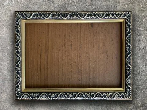 Rustic picture frame on cement wall Stock Photos