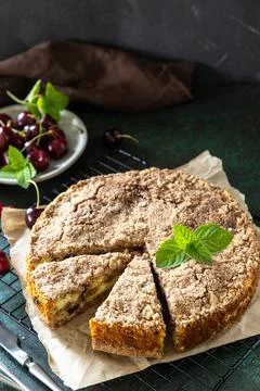 Rustic pie with cottage cheese. Cake with cottage cheese, cherry and streusel Stock Photos
