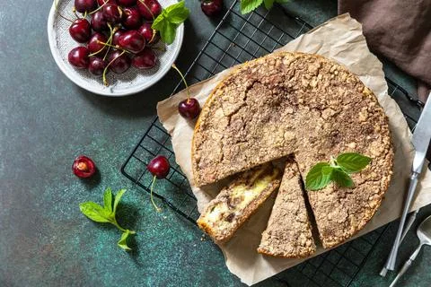 Rustic pie with cottage cheese. Cake with cottage cheese, cherry and streusel Stock Photos