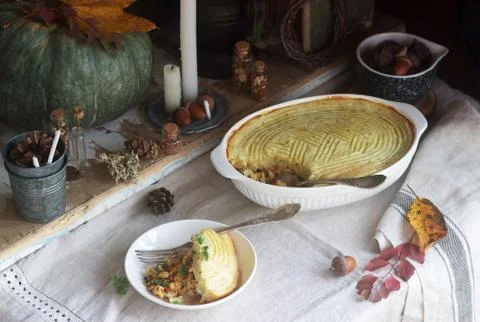 Rustic pie stuffed with minced chicken and cauliflower, and autumn still life on Stock Photos