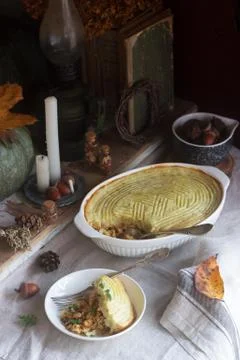 Rustic pie stuffed with minced chicken and cauliflower, and autumn still life on Stock Photos