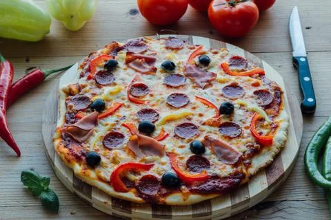 Rustic pizza with sausage Stock Photos