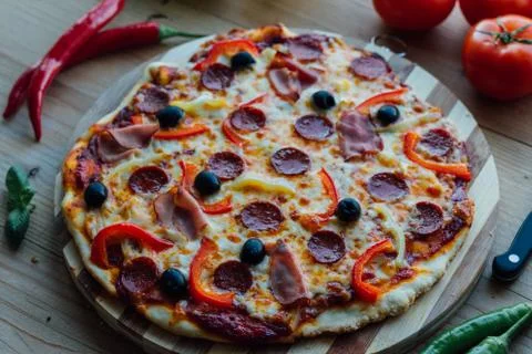 Rustic pizza with sausage Stock Photos