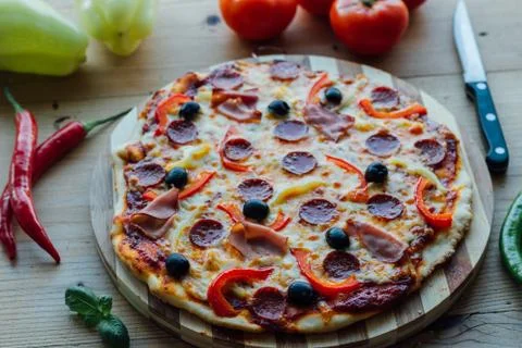 Rustic pizza with sausage Stock Photos
