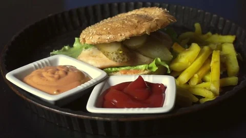 Rustic plate with burger Stock Footage 72960289