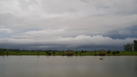 Rustic pond and clouds, timelapse Stock Footage 117909917