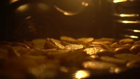 Rustic potatoes are baked in an oven. Potatoes with spices are fried in oil. Stock Footage 173357190