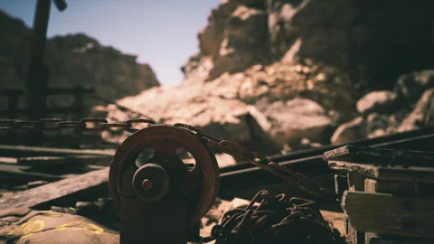 Rustic pulley system in an abandoned mining area under bright sunlight Stock Footage 331399583