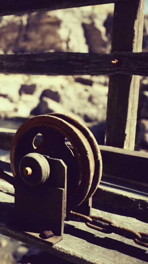 Rustic pulley system showcased in a sunlit outdoor workshop Stock Footage 331833692