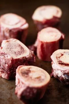 Rustic raw uncooked beef bone marrow Stock Photos