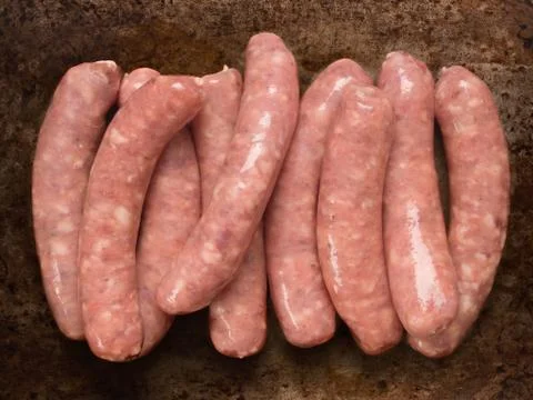 Rustic raw uncooked sausages Stock Photos