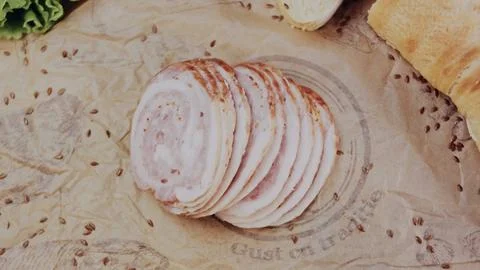Rustic recipe demonstration: cutting a filled sandwich for serving Stock Photos