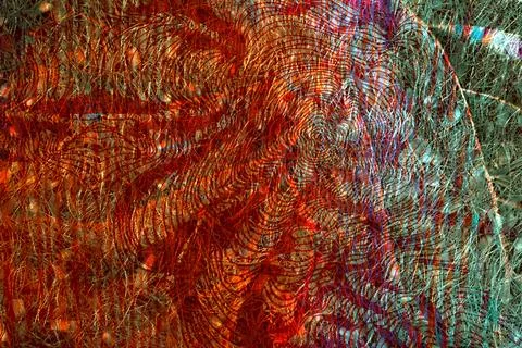 Rustic red and green abstract featuring layered circular lines and dense texture Stock Photos