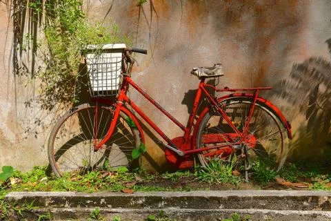 Rustic red bicycle Stock Photos