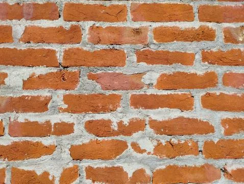 Rustic Red Brick Wall with Rough Mortar Stock Photos