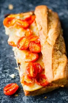 Rustic red cherry tomato and cheese sandwich Stock Photos