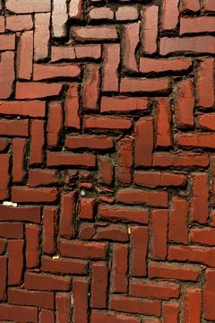 Rustic red clay brick walkway texture, old herringbone pattern street pavement Stock Photos