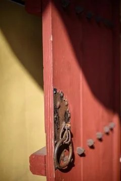 Rustic Red Door with Metal Handle Stock Photos