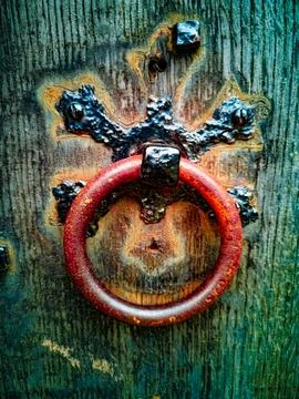 Rustic Red Metal Ring Door Handle on Weathered Wood Stock Photos